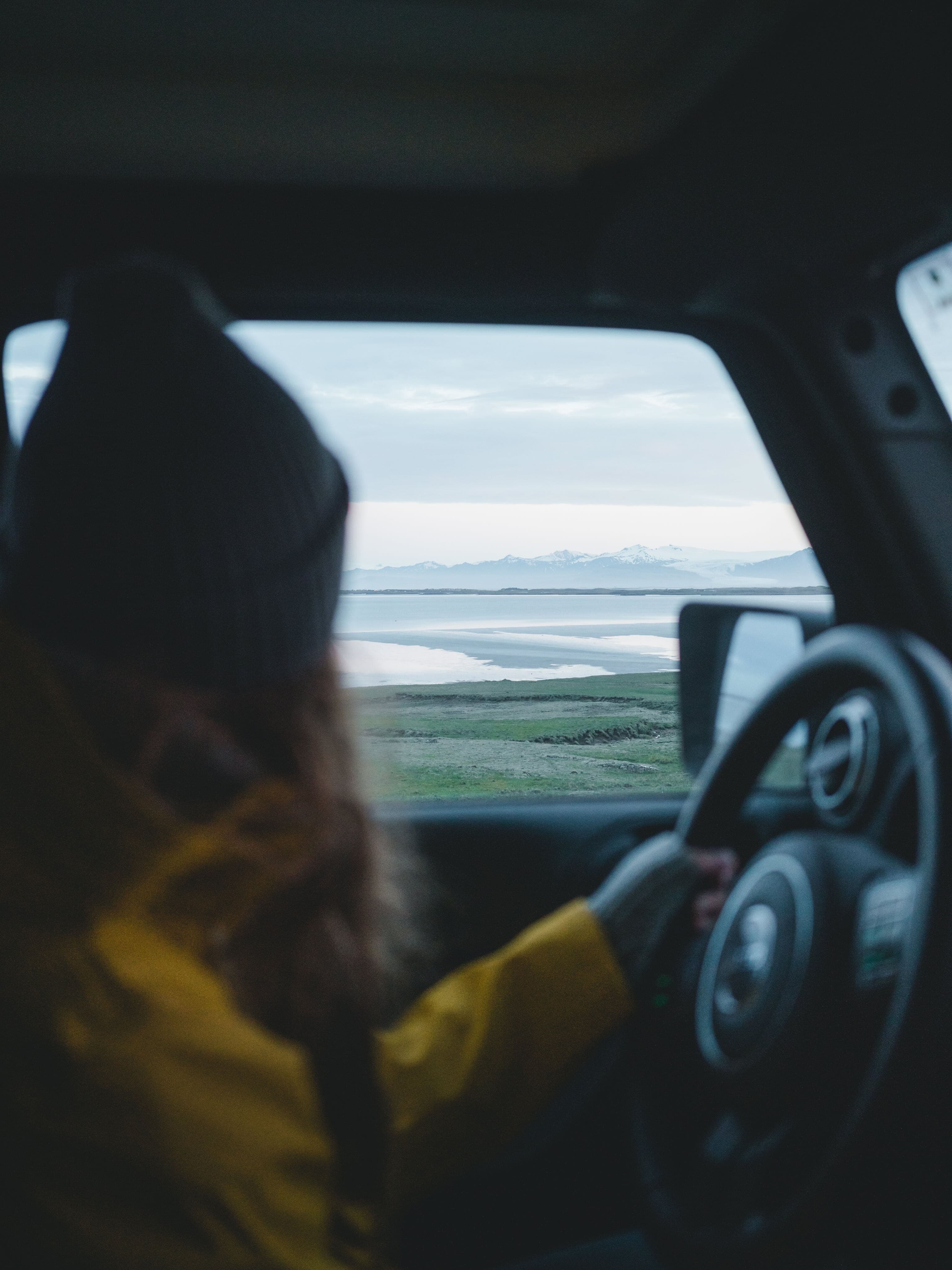 Person driving while looking out of the window.